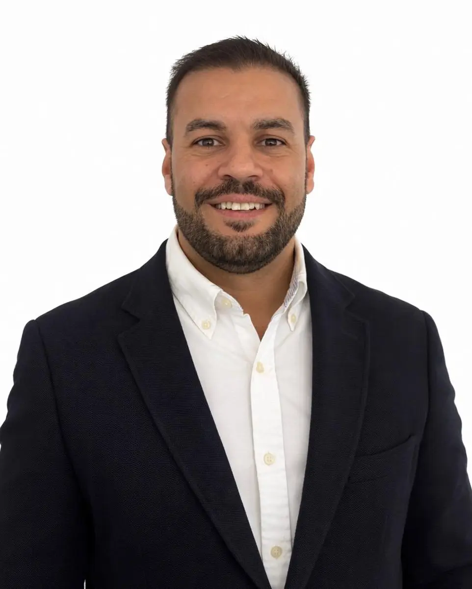 a man in a suit and tie posing for a picture